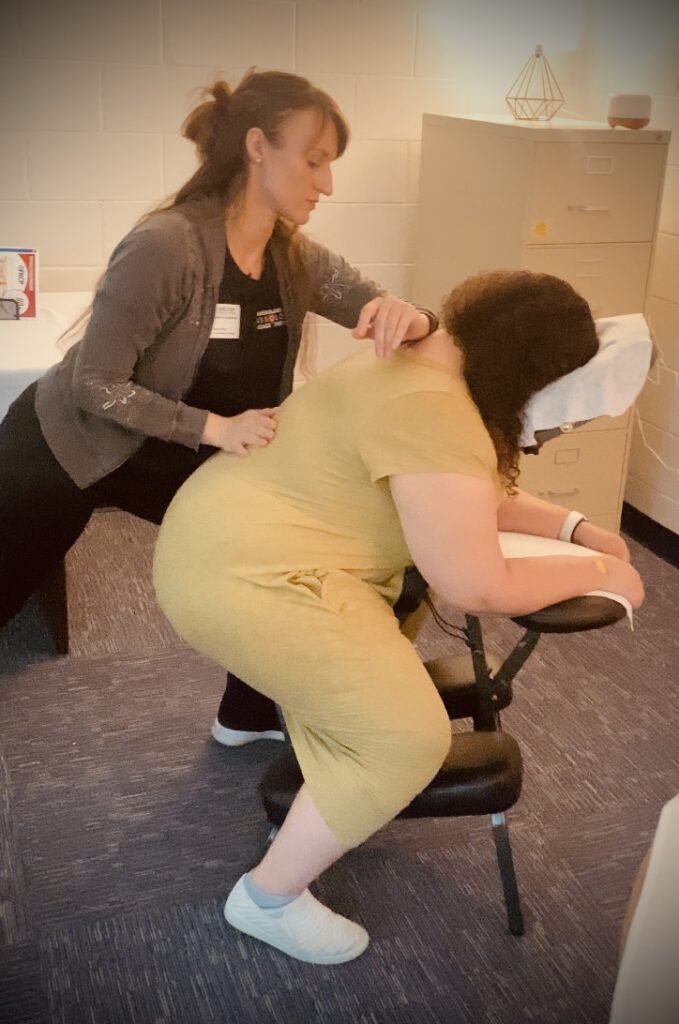 a licensed massage therapist performing chair massage, expert corporate massage in st augustine, FL